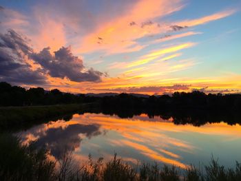 Scenic view of lake at sunset