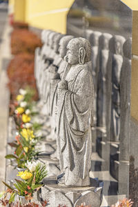 Statue of buddha against temple