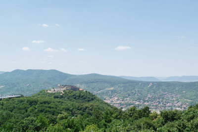 Scenic view of town against sky