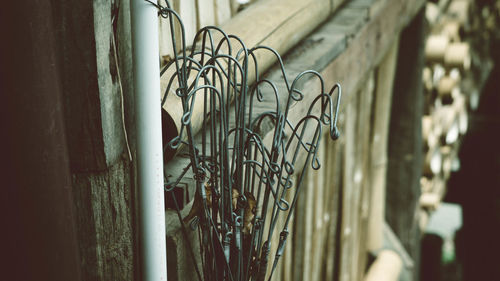 Close-up of metal railing against building