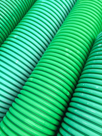 Full frame shot of green plastic pipes