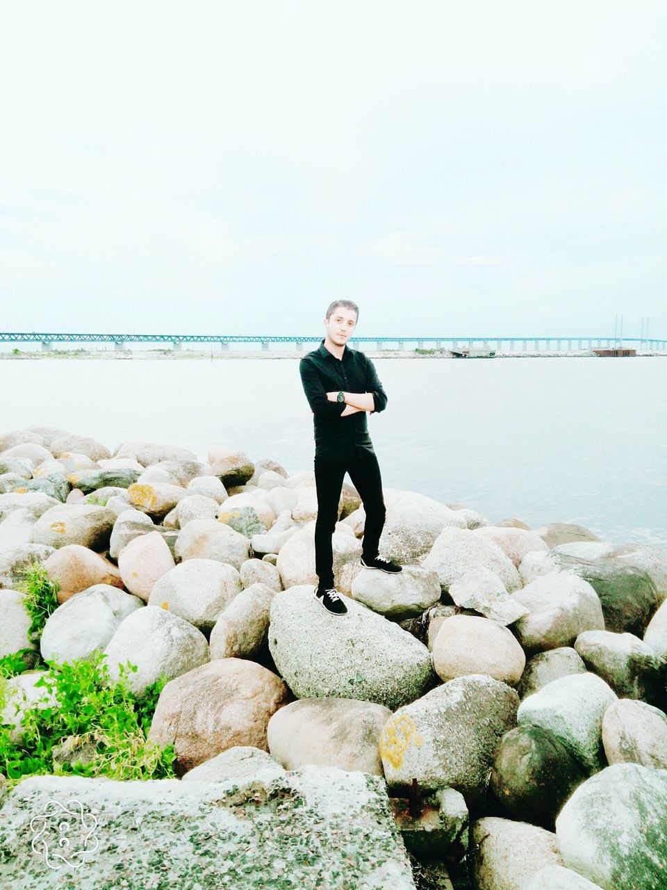 PORTRAIT OF MAN STANDING ON BEACH