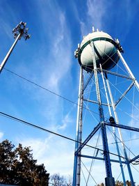 Low angle view of communications tower against sky
