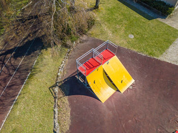 High angle view of arrow sign at park