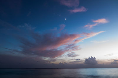 Scenic view of sea against sky at sunset