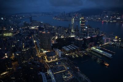 High angle view of illuminated city buildings at night