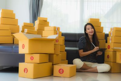 Young woman using phone sitting in office