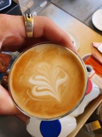 High angle view of coffee cup on table