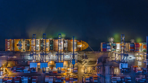 High angle view of container ship at commercial dock