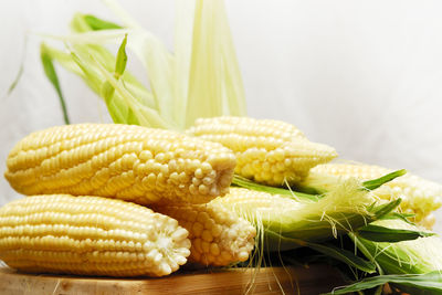 Close-up of sweetcorns on table