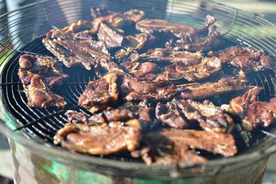 Close-up of meat on barbecue