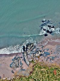 High angle view of wave on beach