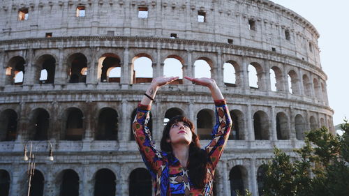 Low angle view of woman in historic building