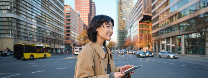 Young woman standing in city