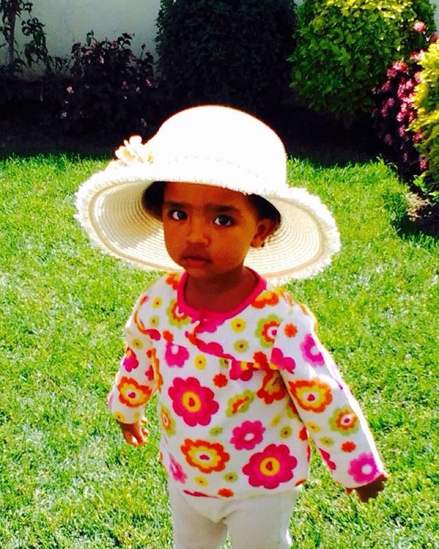 PORTRAIT OF LITTLE GIRL STANDING ON GRASS