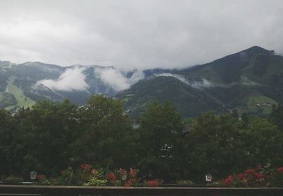 Scenic view of mountains against cloudy sky