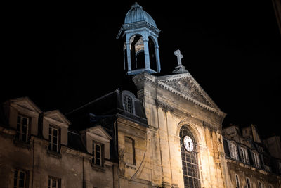 Low angle view of statue at night