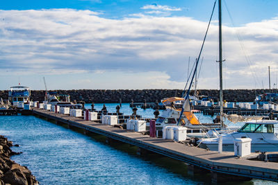 Boats moored at harbor