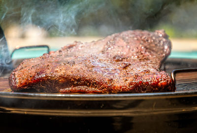 Close-up of meat on barbecue grill