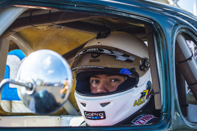 Portrait of a young man in car