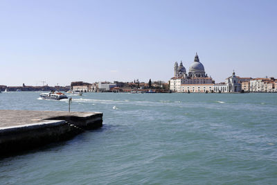 Venice, italy. city skyline, boat traffic in the venetian lagoon, blue and clear sky, sunny day 