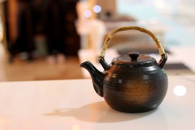 Close-up of teapot on table