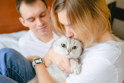 Close-up of girl with cat