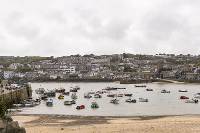 High angle view of beach by buildings against sky