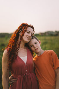 Happy mother having fun with her son outdoor. family and love concept.