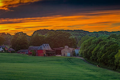 Scenic view of field against sky during sunset