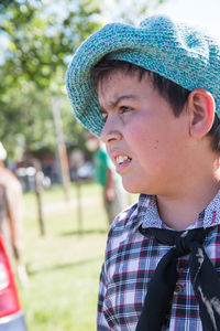 Close-up portrait of boy wearing hat