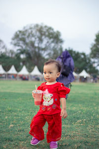 Cute baby girl on field