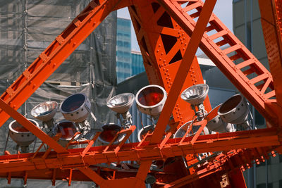 Low angle view of crane against sky