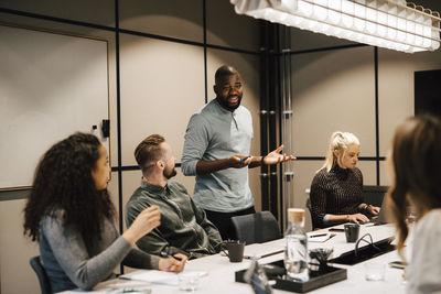 Coworkers having meeting in office