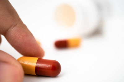 Close-up of hand holding paper