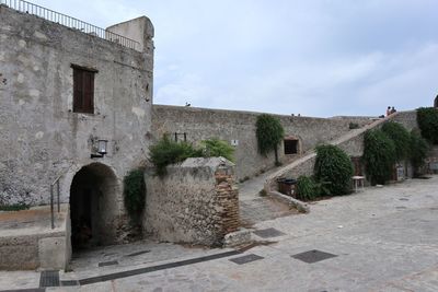 Old building against cloudy sky