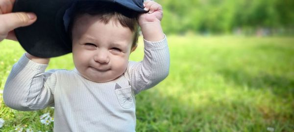 Full length of cute baby girl on field