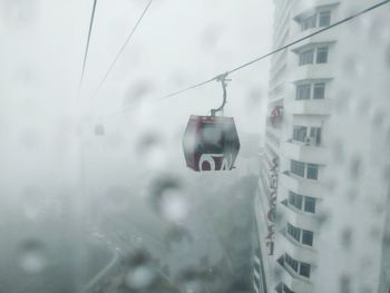 Buildings seen through wet window during rainy season