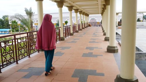 Rear view of woman against the sky