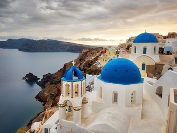 Panoramic view of sea and buildings against sky