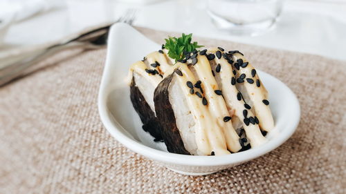 Close-up of sushi served in bowl on table