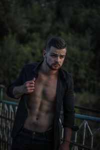 Portrait of young man standing outdoors