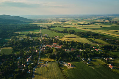 Aerial view of countryside area with village and mountains