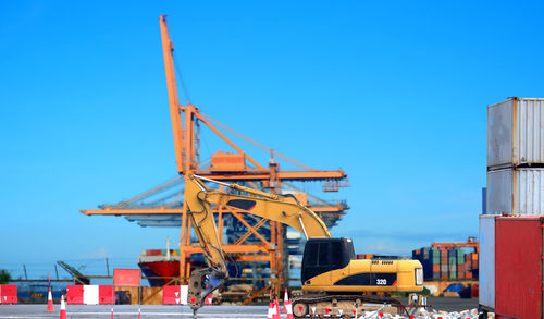 Construction site against clear blue sky