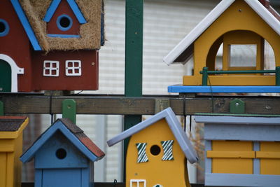 Colorful birdhouses in back yard