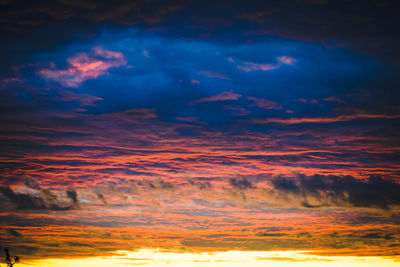 Low angle view of dramatic sky during sunset