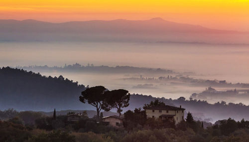 Scenic view of mountains against sky during sunset