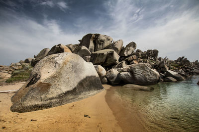 Rocks on shore against sky