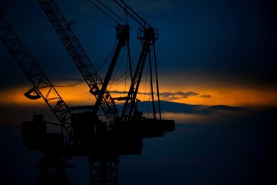 Silhouette ship against sky during sunset