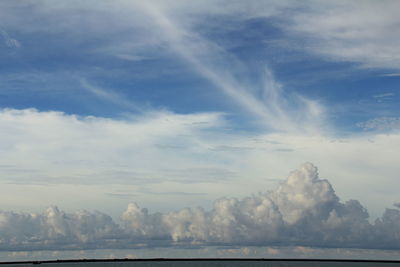 Scenic view of rainbow over sea against sky